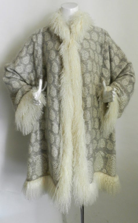 Pierre Balmain Haute Couture (Designed by Oscar de la Renta) wool sweater coat / jacket with mongolian lamb fur trim.  Body is a soft woven mohair/wool blend material. Unlined. Excellent condition - worn once. Design is meant to be worn loose and is