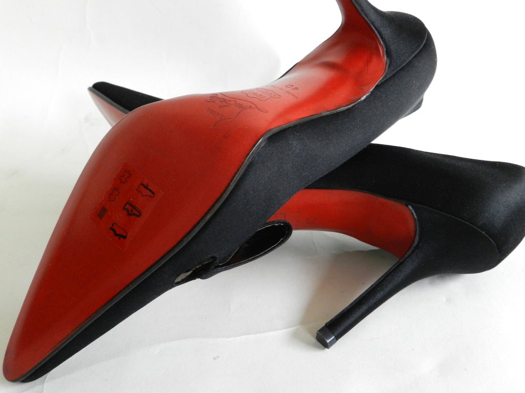 Christian Louboutin black satin heels. Bow detail and signature red bottom. Never worn - only tried on in store. Size 40.