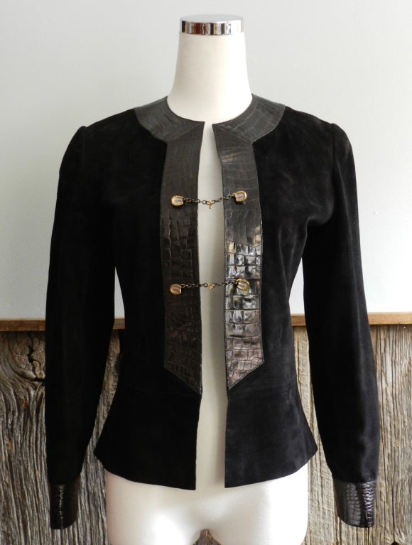 Vintage circa 1970's Gucci black suede jacket with alligator trim front and cuffs. Jacket has sterling silver horseshoe and chain toggle closures at front and cuffs. Excellent vintage condition.  Similar dress from Gucci Archive is pictured in the