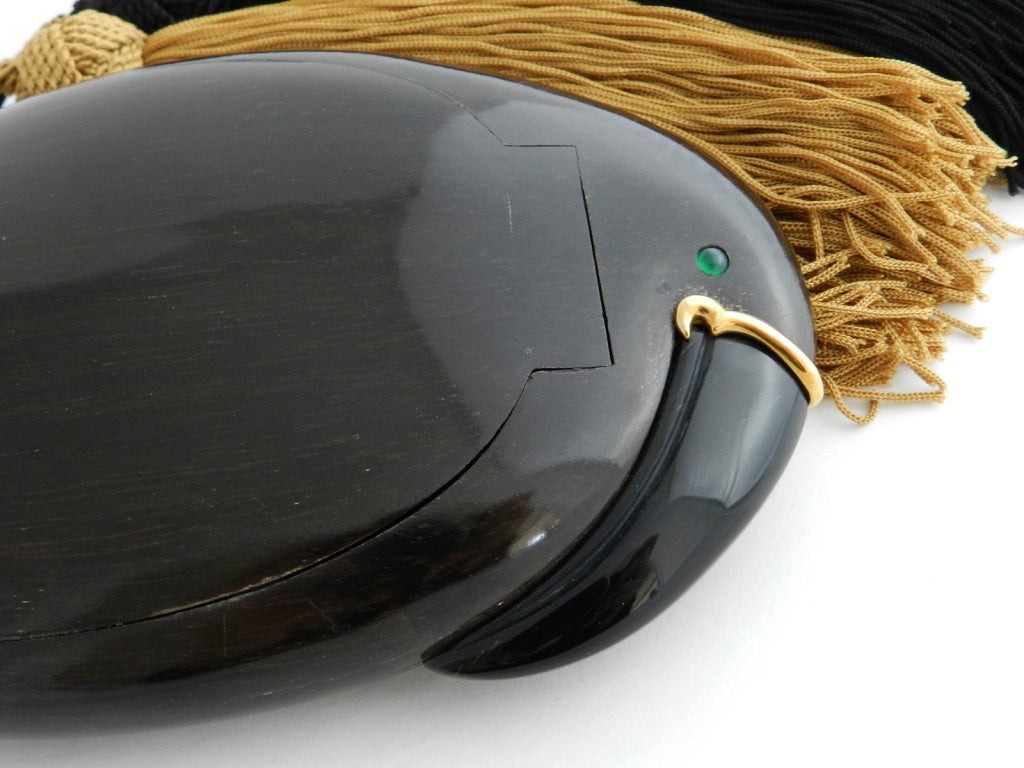 Rare Emanuele Pantanella tassled tropical bird minaudiere.  Made of ebony wood and set with 18K gold, emerald eye, and onyx beak.  Emanuele Pantanella minaudieres can be found in  collections of the Victoria & Albert Museum and Metropolitan Museum