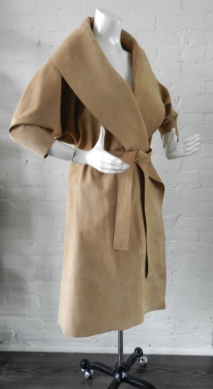 Donna Karan black label nude color suede coat. Excellent pristine condition. Material is bonded Italian deer skin suede on exterior and deer skin leather on interior. Raw unfinished edges, waist fits with sash belt that threads through back, wide