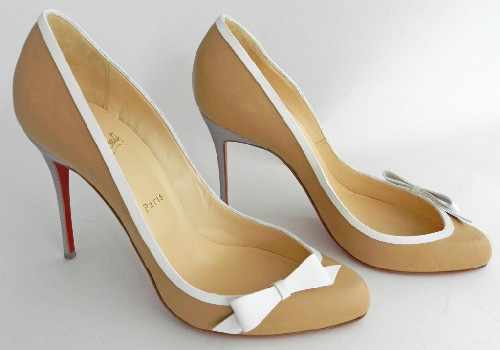 Christian Louboutin nude leather stiletto heel with white leather trim bow. 4.5