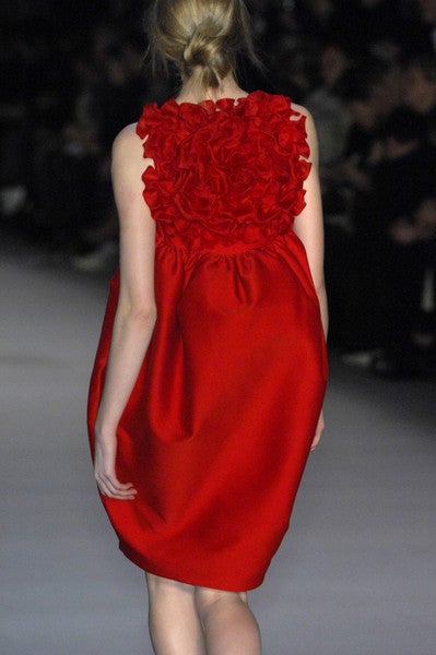 Giambattista Vali Fall 2008 Red Runway Dress.  This dress is in the MOMA collection. Huge silk petal flower adorns the back of the cocoon dress.  Red silk and wool, fully lined in red silk.
Measurements:
Bust:  36