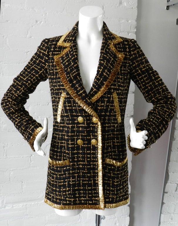 Chanel 2007 Resort runway collection black and amber tweed jacket with metallic gold trim and CC enamel buttons.  Excellent previously owned condition - worn only a few times - no flaws.  Tagged size Chanel 36. Shoulders 14.55, sleeve 24