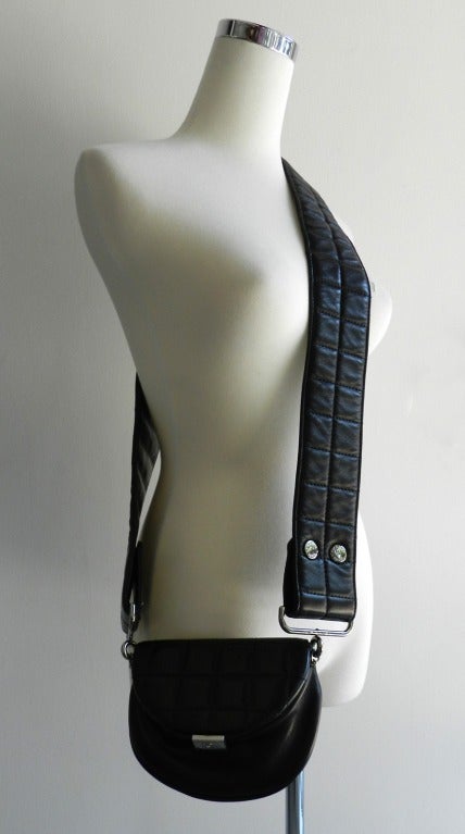Chanel black soft lambskin quilted cross-body purse.  Fall 2003 runway. Silvertone hardware.  Excellent previously owned condition. Body measures 6.25 x 5 x 2.25 inches. The strap is 2.5