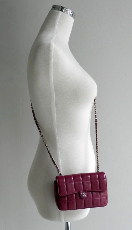 Chanel Raspberry wallet on chain. Soft quilted lambskin with long cross-body chain strap.  Matte silvertone hardware, duster, card, and care booklet. Body measures 6 x 4.25 x 1.5