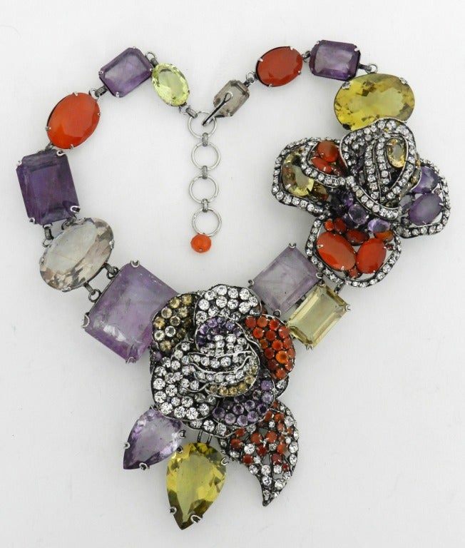 Iradj Moini huge jewelled statement necklace with semi-precious stones.  The two large flower sections detach and can be worn as oversized flower brooches.  Amethyst, carnelian, rutilated quartz, citrine, cubic zirconia detail.  22