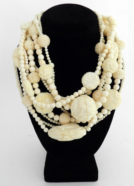 Stephen Dweck carved bone multi-strand choker necklace. Japanese netsuke inspired motif with koi fish and flowers. 9 strands. Shortest strand is 16