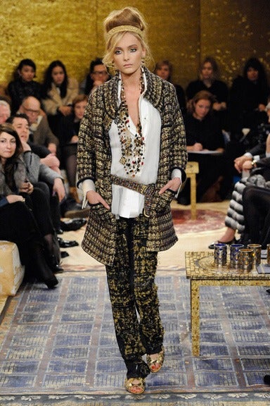 Chanel pre-fall 2011 Byzantine collection runway sweater coat / jacket.  Colours are mainly dark burgundy, black, and gold. The sweater snaps closed with 5 large gold buttons with Gripoix glass stones and enamel.  Wide stand-up collar, and 3/4