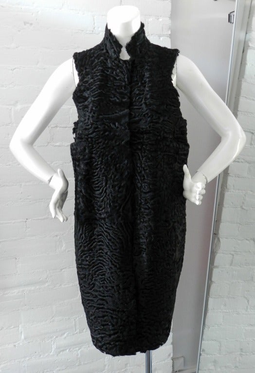 Marni black curly lamb fur and wool vest.  Tapered at back hem with darts, large armholes so it can be worn over a long sleeve jacket or sweater, fastens with hidden snaps down front. Excellent previously owned condition. Tagged size 40. 