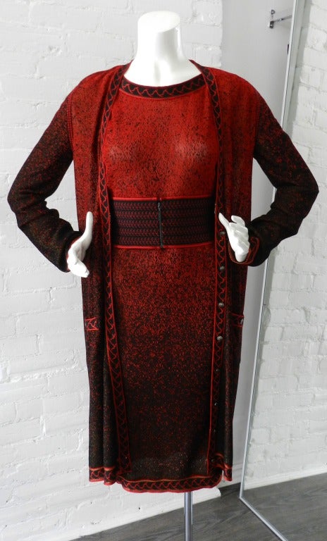 Chanel black and red knit jersey dress with matching elastic waist cincher belt. Matching long cardigan is also available separately for an additional cost.  The material is light semi-sheer and has gold metallic shimmer throughout. Dress is a loose