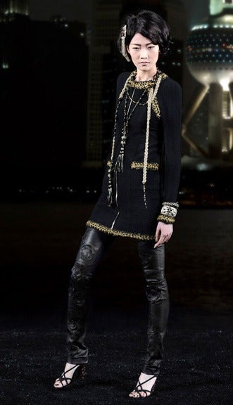 Chanel 2010 pre-fall Shanghai collection black fitted jacket dress.  Gold zipper down centre front, gold metallic trim, lined in silk. Excellent condition. Tagged Chanel size 38 (USA 6).  Actual garment bust 36