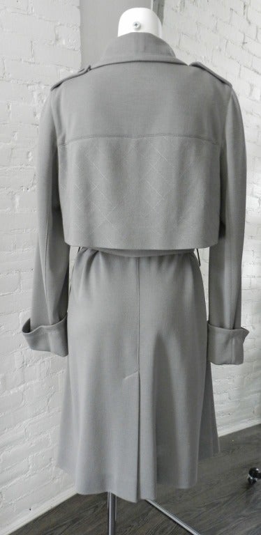 Chanel light dove grey colour trench coat / jacket. Flowing wool-knit jersey with quilt top-stitching and plastic CC buttons. Tagged Size Chanel 40 (USA 8). Excellent condition.  Actual garment bust is 42