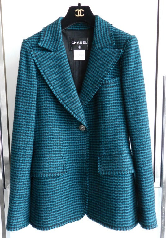 Chanel 2008 Fall black and teal houndstooth jacket. Dark gunmetal color lion head buttons, lined in silk, and chain hem. 53% cashmere, 47% wool. Excellent condition - worn once.  Tagged Chanel size 38 (USA 6).  Actual exact bust is 36