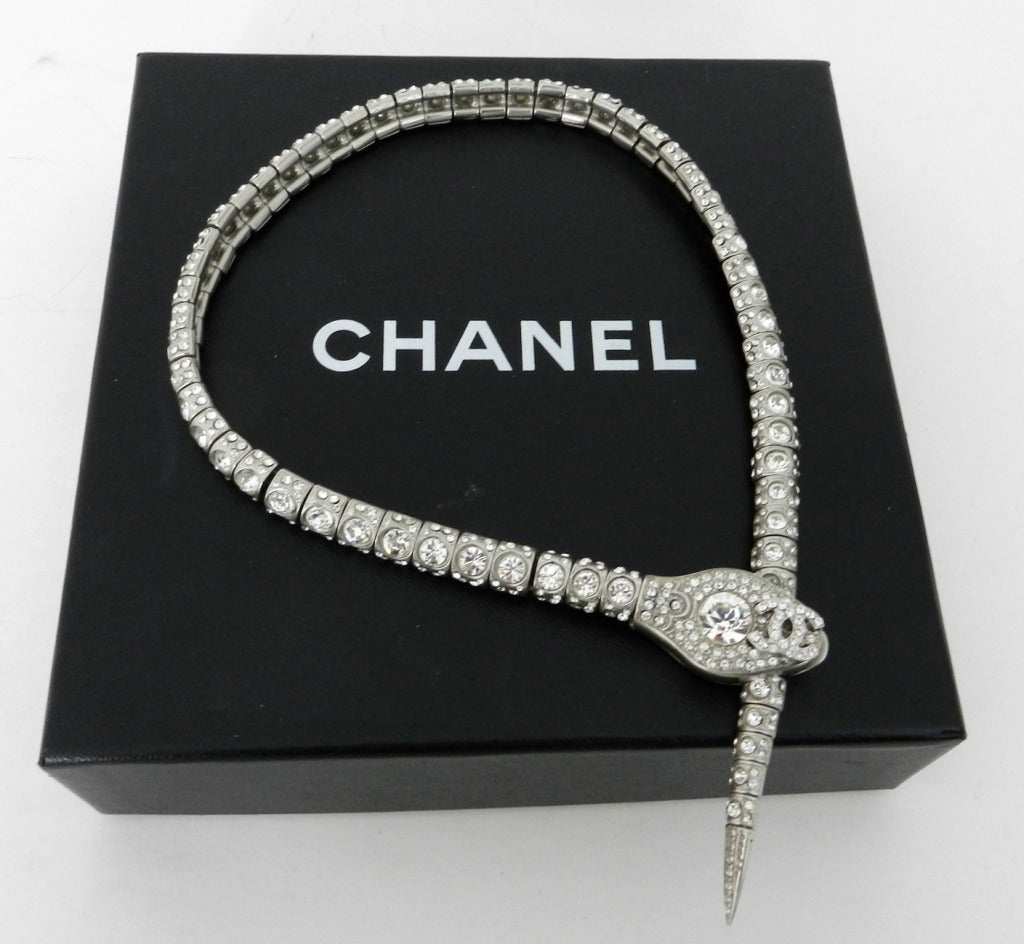 Chanel 2008 resort collection matte silvertone snake necklace with clear rhinestones. Excellent condition - worn once. Can be double coiled to wear as bracelet. Comes with original box. Measures 18