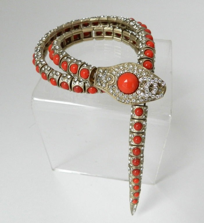 Chanel 2008 Resort runway snake necklace. Coral and clear rhinestone inset with matte champagne gold metal. Can be double coiled to wear as bracelet. Shown as armlet on runway. Excellent condition - worn once. Total length is 18