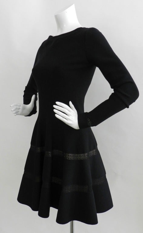 Azzedine Alaia black long sleeve bodycon skater dress.  Circa fall 2013. Excellent condition - worn once. Zips up at centre back, has double layer of nude silk knit lining at skirt, cut-out bands at skirt and cuffs. Tagged size FR 40 (USA 6/8).  To