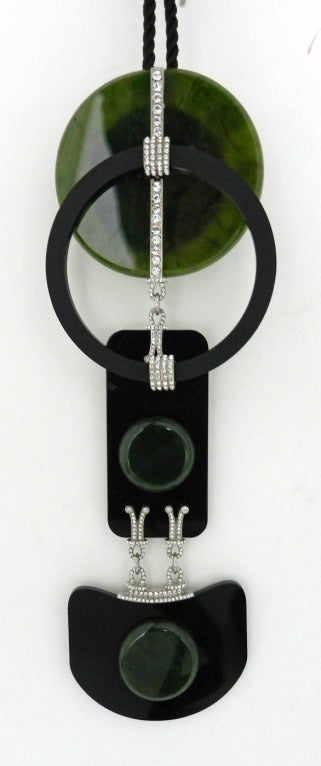 Chanel 2009 fall runway collection green jade and black resin runway pendant necklace. Art Deco graphic design with clear rhinestones and black cord. Excellent condition - worn once. Comes with box. Pendant measures 7.75 x 2.75