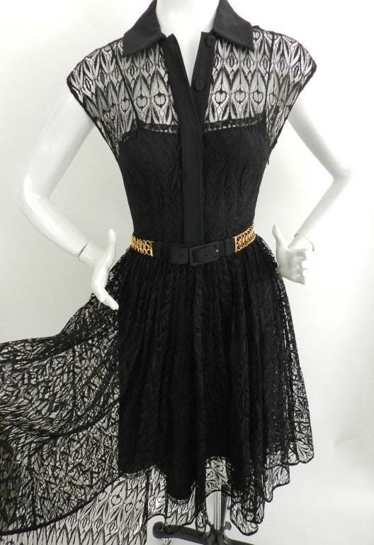 Prada black sheer 1950's style lace dress with goldtone chain mail link belt. 2012 collection - worn once. Excellent condition. The under-dress is 100% silk.  Dress is 74% cotton, 26%nylon. Collar of dress is 74% acetate and 26% viscose. Belt metal