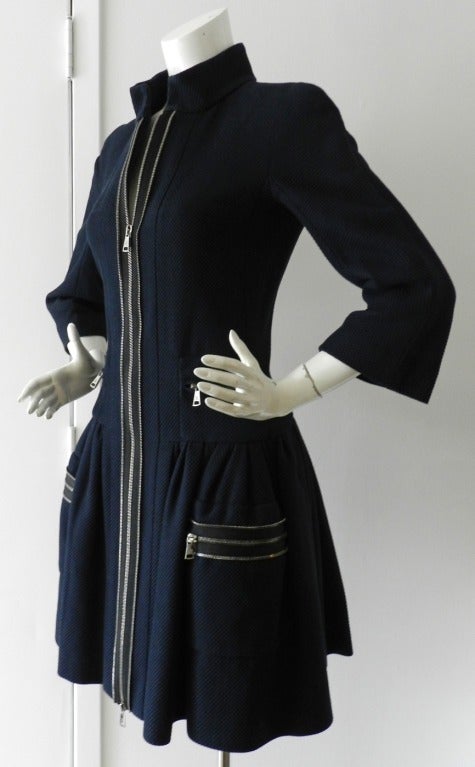 Chanel 2011 Spring navy cotton jacket or dress-coat. Worn once if at all and comes with original Chanel price tag of $3780. Tagged size Chanel 38 (USA 6). Bust to fit 34