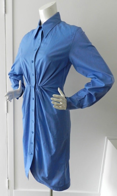 YSL Yves Saint Laurent Spring/Summer 2008 blue cotton shirt dress. Inspired by men's dress shirts.  Buttons down front and at cuffs, gathered at waist, pointed collars. Excellent previously owned condition. Tagged size FR 36 (USA 6). To fit 34