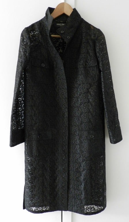 Dolce & Gabanna black lace jacket. Straight-cut design, closes with snaps, stand up collar, front pockets at hip and bust. Excellent condition - worn once. Size USA 4. To fit 34