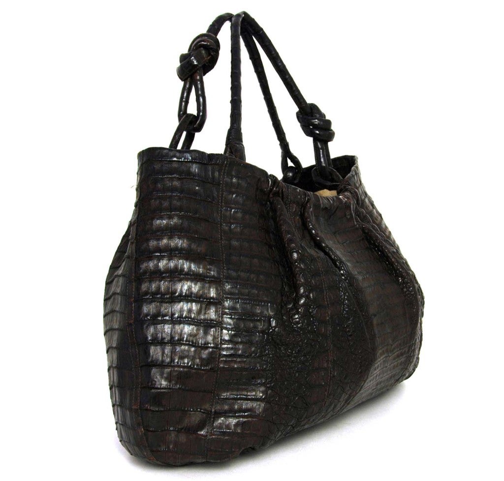 Nancy Gonzalez Brown Crocodile Hobo Bag
Made In Colombia
Materials: Crocodile
Stamped: NANCY GONZALEZ GENUINE CROCODILE MADE IN COLOMBIA
One Zipper Pocket and One Cell-Phone Pocket Inside

Length: 21