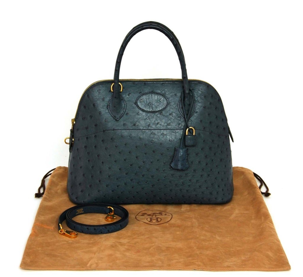 Hermes Blue Ostrich Bolide with Strap
Age: 2001
Made In France
Materials: Ostrich
Stamped: HERMES PARIS MADE IN FRANCE
Blind Stamp Reads: E

Strap Drop: 16.5
