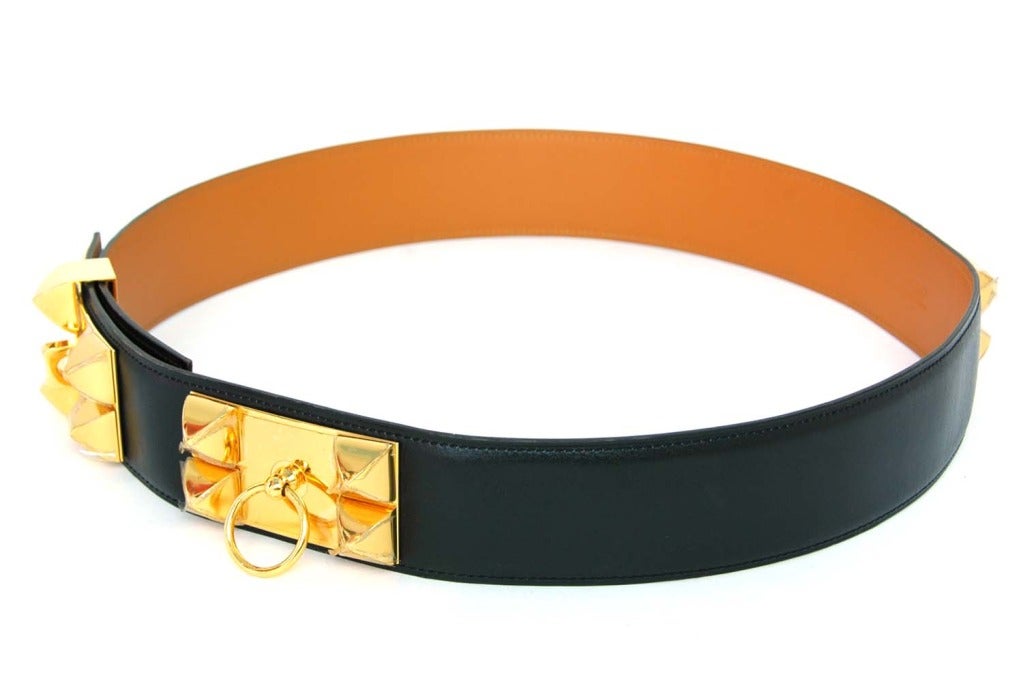 HERMES New Black Collier De Chien CDC Belt With Gold Hardware

    Made In France
    Materials: Leather, Gold Hardware
    Features Gold Hardware Including Pyramid Studs And Door Knocker Accent. Five Slots For Different Waist Sizes With Sliding