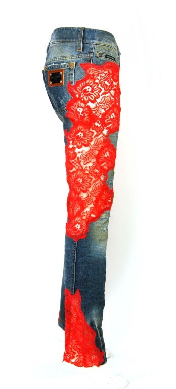 DOLCE & GABBANA Blue Jeans W. Sheer Red Lace Applique Sz. 40

    Made In Italy
    Materials: 70% Cotton, 20% Nylon, 10% Viscose.
    Features distressed denim with fading, stone washing, tearing and whiskering effects. Sheer red applique on