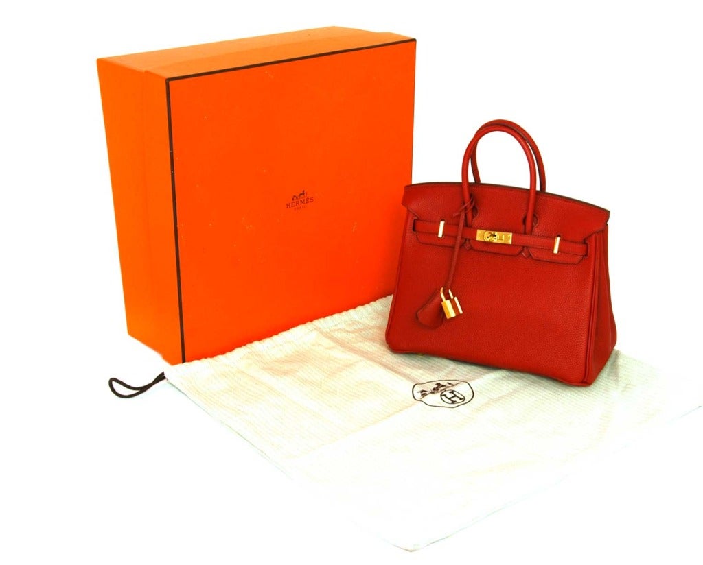 HERMES Red Togo Leather 25cm Birkin Bag With Gold Hardware

Age: 2007
Made In France
Materials: Togo Leather, Gold Tone Hardware.
Features Rich Red Textured Togo Leather, Double Top Handles, Crossover Straps With Classic Hermes Turnlock
