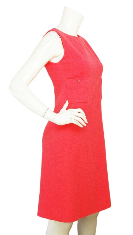 Chanel coral sleeveless boucle dress
Age: 1996
Made in France
Materials: 90% wool, 10% nylon with 100% silk lining
Closes with rear zipper
Two front pockets with CC buttons

Marked size: 40

US size: 8

Bust: 32