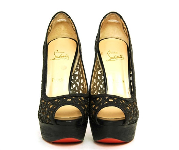 CHRISTIAN LOUBOUTIN Black Leather Brocade & Mesh Pumps Sz. 39/9

Made In Italy
Materials: Mesh, Leather, Wooden Heel.
Features Floral Brocade Patterned Leather With Mesh Underlay. Peeptoe, Wooden Heel And Platform and Classic Red Sole.

Marked