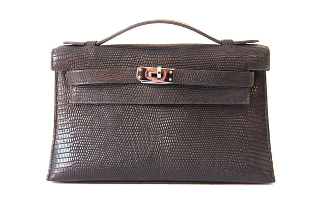 A celebrity favorite, the Hermes Kelly Pochette is a must-have addition to any Hermes lover's collection!<br />
<br />
Realized in black exotic lizard with palladium hardware.<br />
<br />
Front flap with traditional Kelly twist-lock closure and