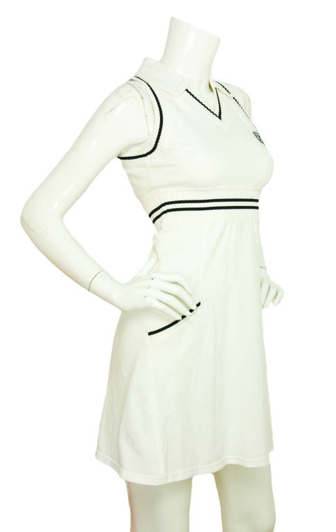 CHANEL White Sleeveless Collared Tennis Dress W. Navy Blue Accents Sz. 36
Made in France
Materials: 97% cotton, 3% elastic. Lining: 100% polyester.
Features white sleeveless dress with collar and v-neck. Ribbed navy and white piping around around