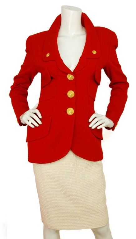 CHANEL Red Vintage Blazer W. Woven Gold Buttons Sz. 38
Age: Estimated to be from the early 1990's
Materials: 100% wool, Lining: 100% silk.
Features single breasted blazer with curved collar. Woven gold logo buttons down center, on lapels and at