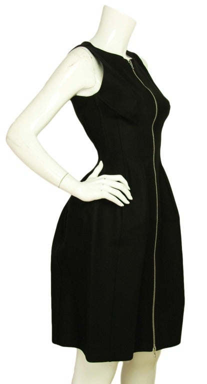 ALAIA PARIS NWT Black Peplum Zip Front Sleeveless Dress Sz. 40
Made in France
Materials: 97% cotton, 3% polyurethane.
Features body-conscious, sleeveless black dress with a silver zipper down the center. Dress narrows at waist and the bottom is