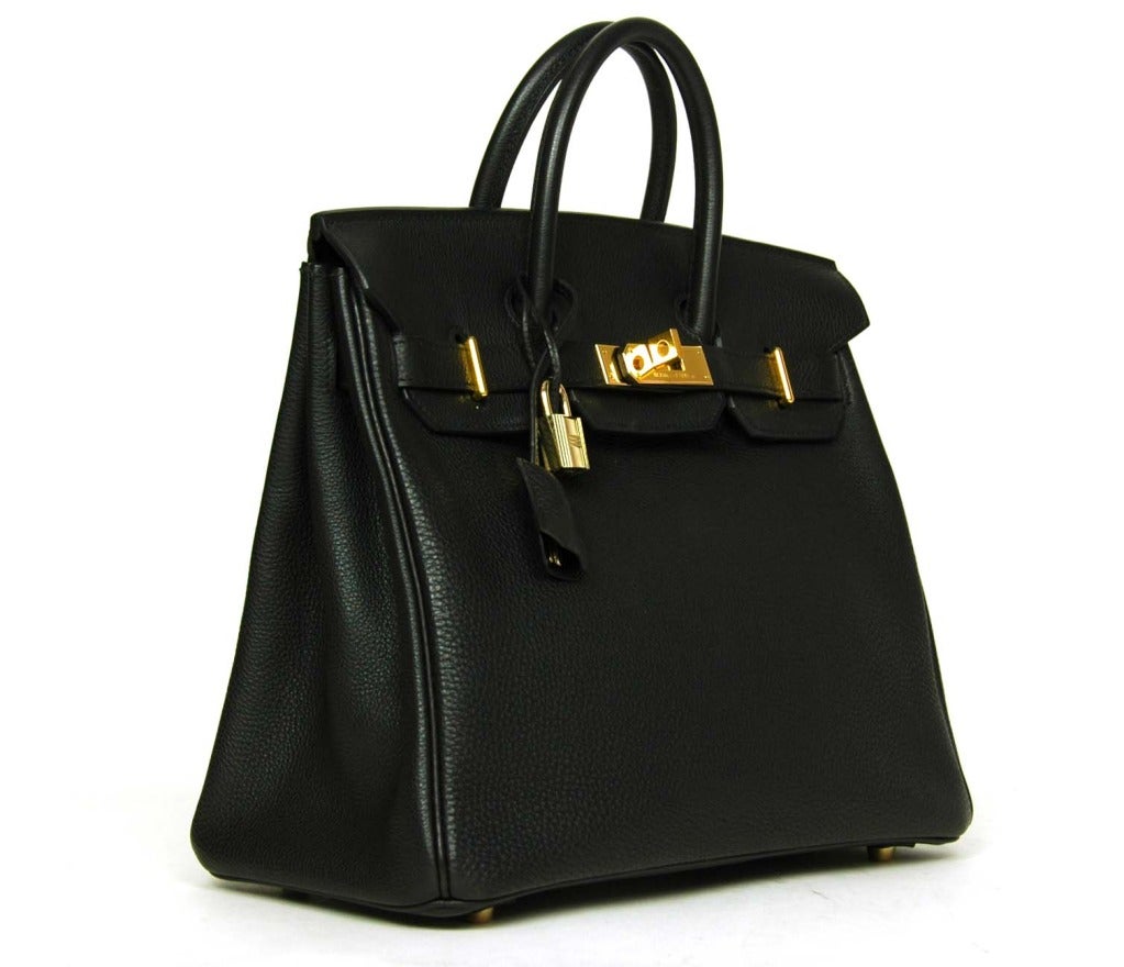 HERMES Black Togo Leather 28cm HAC Birkin W. GHW c. 2010
Age: 2010
Made in France
Materials: togo leather, gold hardware.
Features taller HAC style birkin in textured leather with goldtone hardware. Two top handles with dangling clochette (lock