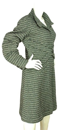CHANEL Tweed Coat With Pleated Elbows Sz. 42
Made in France
Materials: 60% wool, 37% angora, 3% spandex.
Features crisscross front detail with logo button and nine hidden buttons down center. 

Marked size: 42
Shoulder: 18