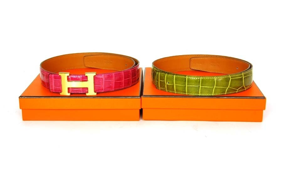 HERMES Brushed Gold H Buckle W. Pink & Green Porosus Crocodile Belts
Sz. 80 - c. 2006
Age: 2006
Made in France
Materials: porosus crocodile, leather, brushed gold buckle.
Features brushed gold logo H belt buckle with two straps: one is pink