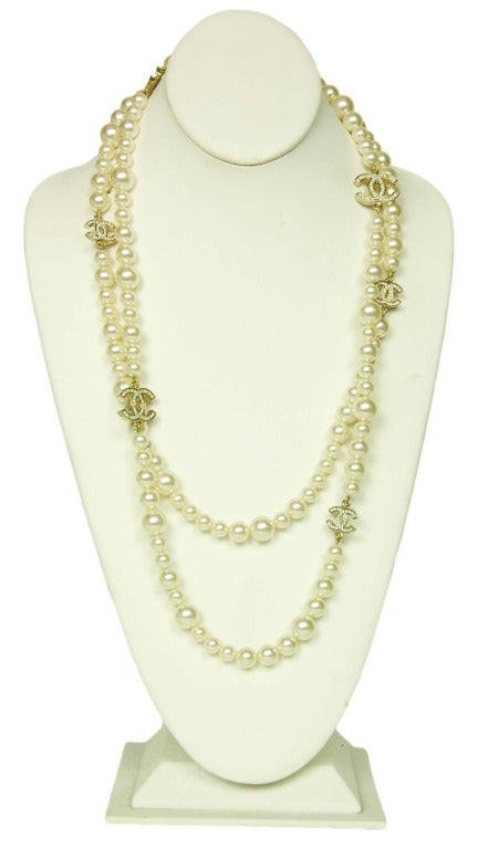 CHANEL Double Strand Pearl Necklace With Crystal CC Charms c. 2010
Age: 2010
Made in France
Materials: faux pearls, crystal CC charms.
Features two strands of pearls, one slightly longer, with graduated CC crystal charms. Lobster clasp closure.
