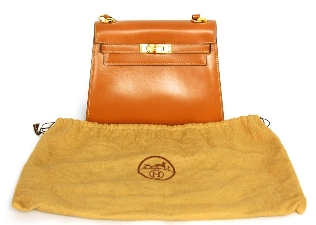 tan leather hermes bag with an h