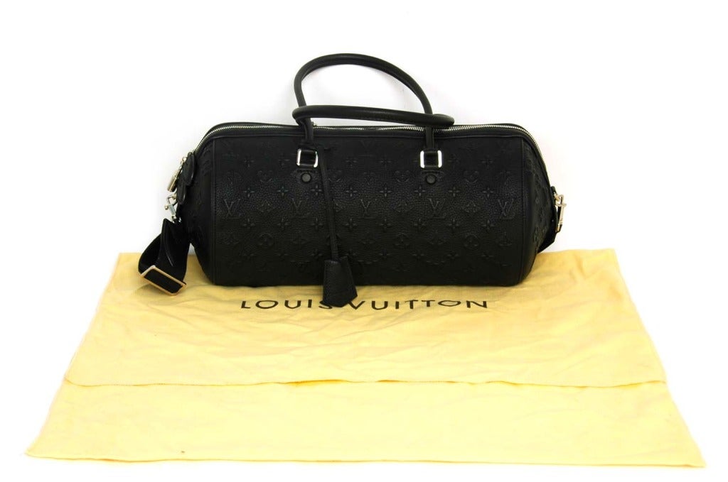 Louis Vuitton Black Leather Embossed Monogram Papillon Bag
Age: 2012 
Retail: $3,950
Made in France
Materials: exterior: monogram embossed leather, interior: black alcantara & leather lining
Stamped: LOUIS VUITTON PARIS MADE IN FRANCE