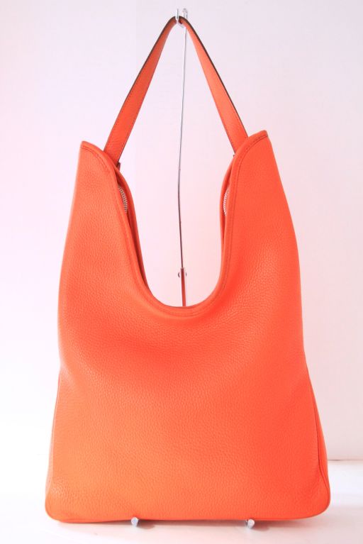 This HERMES Orange Togo Leather Massai Bag is the perfect alternative to a Birkin Bag. <br />
<br />
It closes with a dual zipper closure on the top.  Single top handle/shoulder strap stamped with 