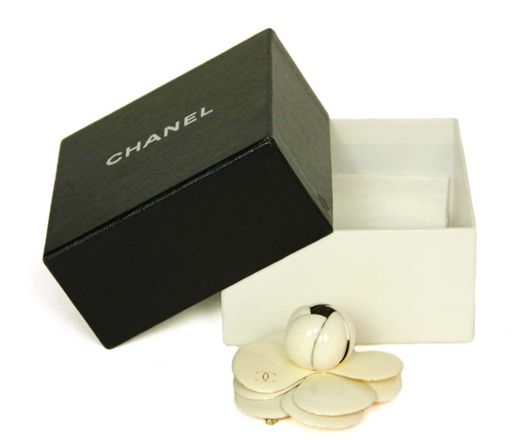 Chanel Ivory Enamel Camelia Pin With CC

Age: c. 2002
Materials: enamel, goldtone metal
Made in Italy
Stamped 