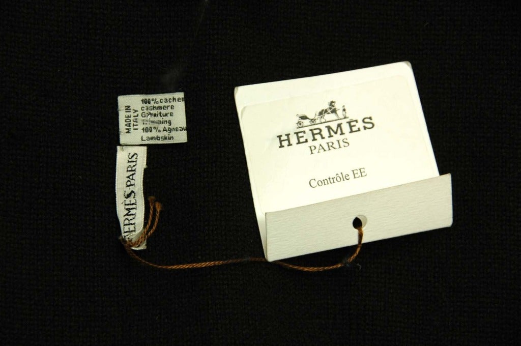 Hermes Black Cashmere & Leather Scarf
Features black leather middle panel
Made In: Italy
Color: Black
Composition: 100% cashmere, 100% lambskin leather
Retail Price: $1,825 + tax
Overall Condition: Excellent- tags still attached
Includes: