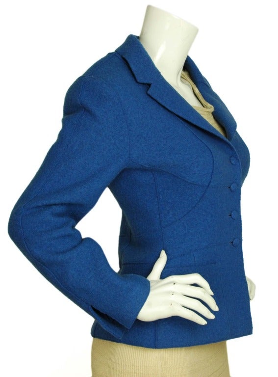 CHANEL Cobalt Blue Boucle Blazer W. Shoulder Pads Sz. 36 c. 1999
Age: 1999
Made in France
Materials: 100% wool,. Lining: 90% silk, 10% spandex.
Features single breasted cobalt blue boucle wool blazer. Four buttons down the center, two slip