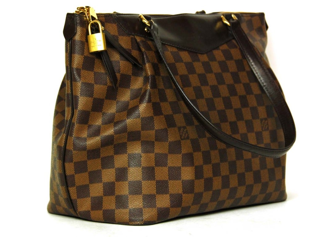 LOUIS VUITTON Brown Damier Check Canvas 'Westminster GM' Tote c. 2012
Age: 2012
Made in USA
Materials: coated canvas, canvas, leather, goldtone hardware.
Features zipper top tote bag in classic brown damier checkered canvas with dark brown