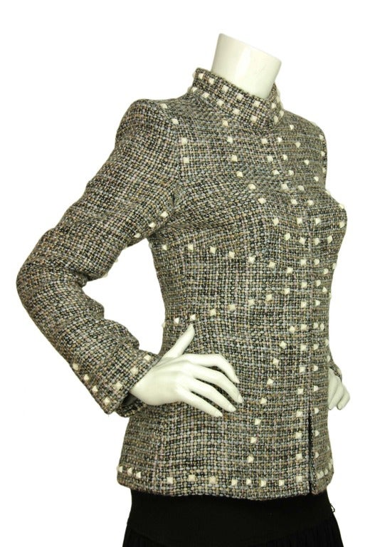 CHANEL Black, Pink & Blue Tweed Jacket W. White Pyramid Studs Sz. 38 c. 2003
Age: 2003
Made in France
Materials: 51% rayon, 46% wool, 3% nylon. Lining: 95% silk, 5% spandex.
Features single breasted tweed blazer with oriental collar and white