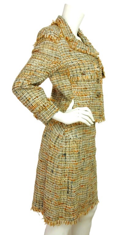 CHANEL Cream/Brown/Orange Tweed Skirt Suit With Fringe Trim - Sz 10 (c. 1998)

Age: c. 1998
Made in France
Composition: 70% nylon, 20% acrylic, 5% rayon, 5% wool
Two front pockets w/tweed pattern CC buttons
Four button front closure with same